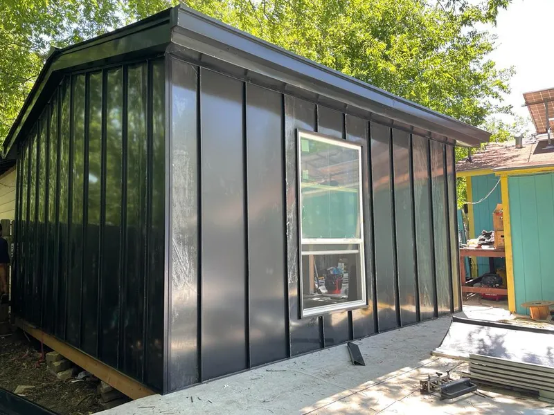 Black standing seam metal wall panels for Roof Inspection in North Chicago